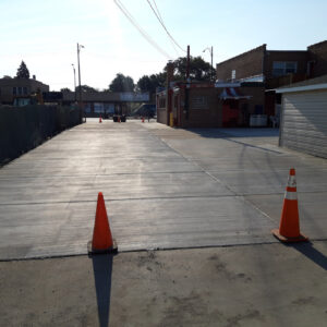 Newly paved concrete driveway construction