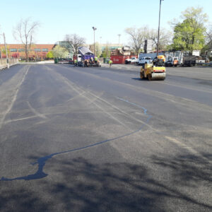 Freshly paved asphalt construction vehicles