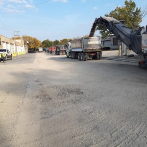 Street redevelopment machinery and dump trucks