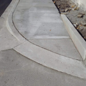 Freshly paved concrete sidewalk construction