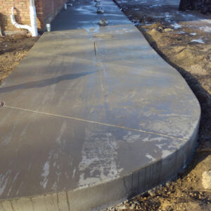 Freshly poured concrete sidewalk construction