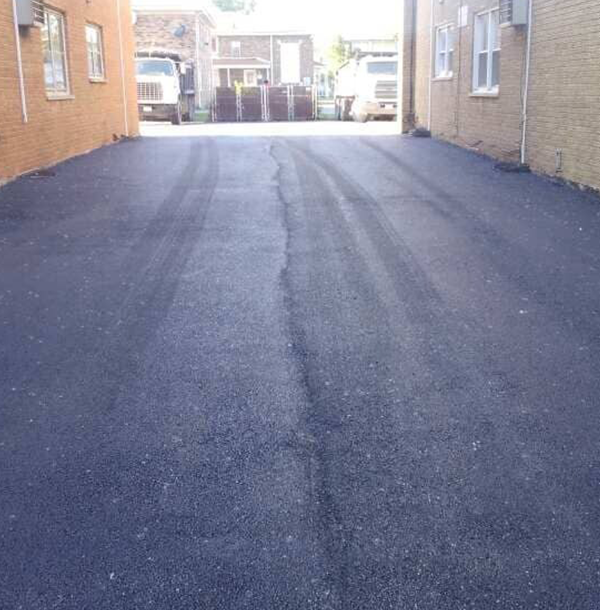 Freshly paved urban asphalt driveway